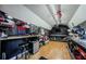 This workshop has storage shelves, workbenches, tool storage, and wood flooring at 7241 56Th N Ave, St Petersburg, FL 33709