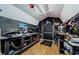 A spacious workshop with workbenches, shelving, storage, and an exterior door at 7241 56Th N Ave, St Petersburg, FL 33709