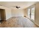 Spacious bedroom featuring wood-look tile flooring and a ceiling fan at 754 Seminole Blvd, Tarpon Springs, FL 34689