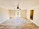 Bedroom featuring wood-look flooring, access to bathroom, and door to outdoor patio at 754 Seminole Blvd, Tarpon Springs, FL 34689