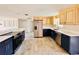 Spacious kitchen featuring stainless steel appliances, custom cabinets, and quartz countertops at 754 Seminole Blvd, Tarpon Springs, FL 34689