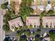 Aerial view of townhomes with parking, landscaping, and proximity to neighborhood amenities at 7826 66Th N Way, Pinellas Park, FL 33781