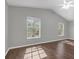 Spacious bedroom with hardwood floors, lots of natural light from two large windows at 7826 66Th N Way, Pinellas Park, FL 33781