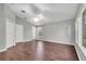 Spacious bedroom features neutral walls, hardwood floors, ceiling fan and a walk-in closet at 7826 66Th N Way, Pinellas Park, FL 33781