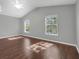 Comfortable bedroom features hardwood floors, ceiling fan, and plenty of natural light from two windows at 7826 66Th N Way, Pinellas Park, FL 33781