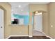 Inviting entryway and views into the kitchen with tiled floors and bright walls, creating a seamless transition at 7826 66Th N Way, Pinellas Park, FL 33781