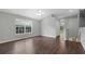 Bright living room features high ceilings, a ceiling fan and a large window for ample natural light at 7826 66Th N Way, Pinellas Park, FL 33781