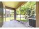 Covered patio provides a tranquil retreat with views of the landscaped backyard and surrounding greenery at 7826 66Th N Way, Pinellas Park, FL 33781
