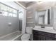 Nicely updated bathroom featuring modern vanity, tiled shower and tub, and stylish fixtures at 8719 Lake Place Ln, Tampa, FL 33634