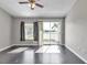 Bedroom boasts sleek wood floors and lots of natural light at 8719 Lake Place Ln, Tampa, FL 33634