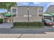 Charming townhome featuring a private courtyard, awning, and convenient covered parking at 8719 Lake Place Ln, Tampa, FL 33634