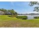 Tranquil lake view surrounded by lush greenery and homes at 8719 Lake Place Ln, Tampa, FL 33634