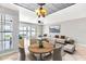 Open living room boasts stylish tile floor, lake views, and modern decor at 8719 Lake Place Ln, Tampa, FL 33634