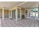 Spacious lanai with tile flooring, offering a seamless transition to outdoor living and entertaining at 8719 Lake Place Ln, Tampa, FL 33634