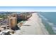 Aerial view of a beachfront condo featuring an ocean view, beach access, and a pool at 880 Mandalay Ave # C908, Clearwater Beach, FL 33767