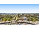 Breathtaking aerial view showcasing the city's beautiful coastline and tranquil ocean waters beyond tropical trees and neighborhoods at 880 Mandalay Ave # C908, Clearwater Beach, FL 33767
