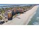 An aerial view of the beachfront high rise condo with pool and ocean access at 880 Mandalay Ave # C908, Clearwater Beach, FL 33767
