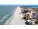 Beautiful aerial view of a beachfront condo with a pool, beach access and ocean views at 880 Mandalay Ave # C908, Clearwater Beach, FL 33767