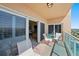 Private balcony with clear views is perfect for outdoor dining and relaxation, accessible from the living area at 880 Mandalay Ave # C908, Clearwater Beach, FL 33767