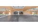 Condo entrance featuring double doors, tiled flooring, and professional office at 880 Mandalay Ave # C908, Clearwater Beach, FL 33767