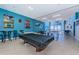 Recreation room with pool table, ping pong table, foosball, ocean view, and ample seating at 880 Mandalay Ave # C908, Clearwater Beach, FL 33767