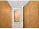 Hallway with tile floors and closet space provides practical storage solutions at 880 Mandalay Ave # C908, Clearwater Beach, FL 33767