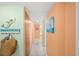 Inviting hallway boasts beach themed decor, leads to bedrooms and living area, with ample closet space at 880 Mandalay Ave # C908, Clearwater Beach, FL 33767