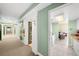 Hallway view features fresh paint and tile flooring, leading into a bright living space and kitchen at 880 Mandalay Ave # C908, Clearwater Beach, FL 33767