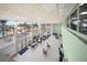 Large community lounge with ocean views, seating and tables for residents at 880 Mandalay Ave # C908, Clearwater Beach, FL 33767