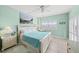 Bright bedroom with shuttered windows offers serene ambiance, stylish decor, and ample space for relaxation at 880 Mandalay Ave # C908, Clearwater Beach, FL 33767