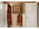 Elegant bathroom featuring shower with curtain, vanity and tiled walls at 8933 Crescent Forest Blvd, New Port Richey, FL 34654