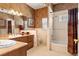 Bathroom with double sink vanity, shower and bathtub at 8933 Crescent Forest Blvd, New Port Richey, FL 34654