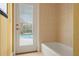 Bathroom features private pool access from shower area at 8933 Crescent Forest Blvd, New Port Richey, FL 34654