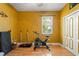 Bedroom features hardwood floors and a large window for natural light at 8933 Crescent Forest Blvd, New Port Richey, FL 34654
