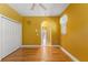 Bedroom features hardwood floors and access to en-suite bathroom at 8933 Crescent Forest Blvd, New Port Richey, FL 34654