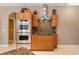 Gourmet kitchen with stainless steel appliances and custom cabinets at 8933 Crescent Forest Blvd, New Port Richey, FL 34654