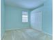 Bright bedroom features a window, closet, and neutral carpeting at 9211 Everwood Ct, Tampa, FL 33647
