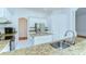 Kitchen with white cabinetry, granite countertops, and stainless steel appliances at 9211 Everwood Ct, Tampa, FL 33647