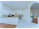 Bright kitchen with granite countertops, white cabinets, and stainless steel appliances at 9211 Everwood Ct, Tampa, FL 33647
