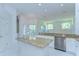 Bright kitchen featuring granite countertops and stainless steel appliances at 9211 Everwood Ct, Tampa, FL 33647