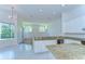 Bright, airy kitchen with granite countertops, stainless appliances, and a seamless connection to the outdoors at 9211 Everwood Ct, Tampa, FL 33647