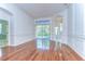 Bright living room with hardwood floors and sliding door to patio at 9211 Everwood Ct, Tampa, FL 33647