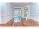 Bright living room featuring hardwood floors and sliding glass doors at 9211 Everwood Ct, Tampa, FL 33647