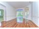 Bright living room with hardwood floors and sliding door to patio at 9211 Everwood Ct, Tampa, FL 33647