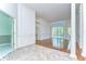 Bright living room with wood floors, columns, and sliding doors to the patio at 9211 Everwood Ct, Tampa, FL 33647