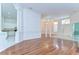 Spacious living room features hardwood floors, columns, and an open concept at 9211 Everwood Ct, Tampa, FL 33647