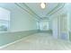 Primary bedroom features tray ceiling, half wall, and carpet at 9211 Everwood Ct, Tampa, FL 33647
