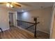 Spacious upstairs hallway features wood-look floors and neutral wall paint at 9660 Sweetwell Pl, Riverview, FL 33569
