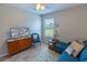 Inviting living room with natural light and cozy seating, complemented by stylish decor and neutral wall paint at 9660 Sweetwell Pl, Riverview, FL 33569