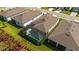 Aerial view of a home with a private screened-in pool and well-maintained yard at 9921 Pier Point Ter, Parrish, FL 34219